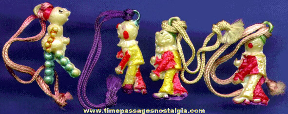 (4) 1930’s Celluloid Clown Charms