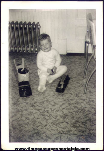 Old Photograph Boy With Metal Toy Trucks