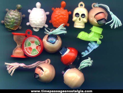 (12) 1960s Mechanical Gum Ball Machine Prize Charms