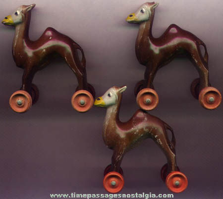 (3) Old Painted Plastic Camel Figure Wheel Toys