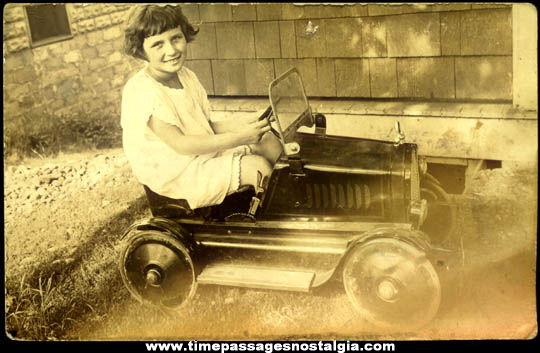 Old Unused Real Photo Post Card Girl in an Early Toy Pedal Car