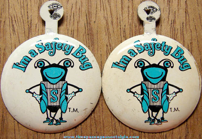 (2) Old Safety Bug Advertising Tin Tab Buttons