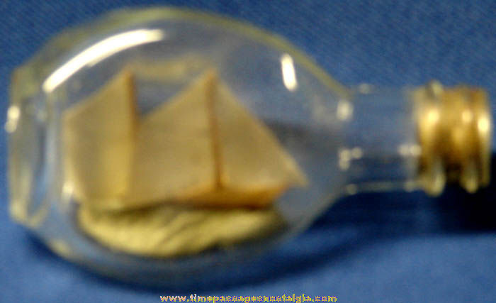 Small Old Wooden Model Sailing Ship In A Bottle