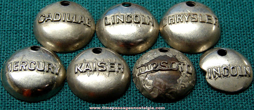 (7) Old Metal Plated Auto Advertising Hubcap Gum Ball Machine Prize Charms
