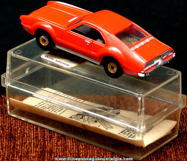 Boxed 1960s Red Oldsmobile Toronado Aurora Slot Car