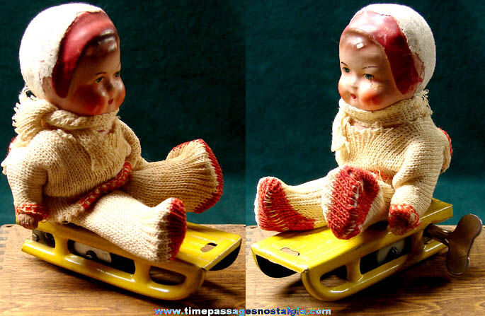 Old German U.S. Zone Key Wind Toy Sled with Baby Doll