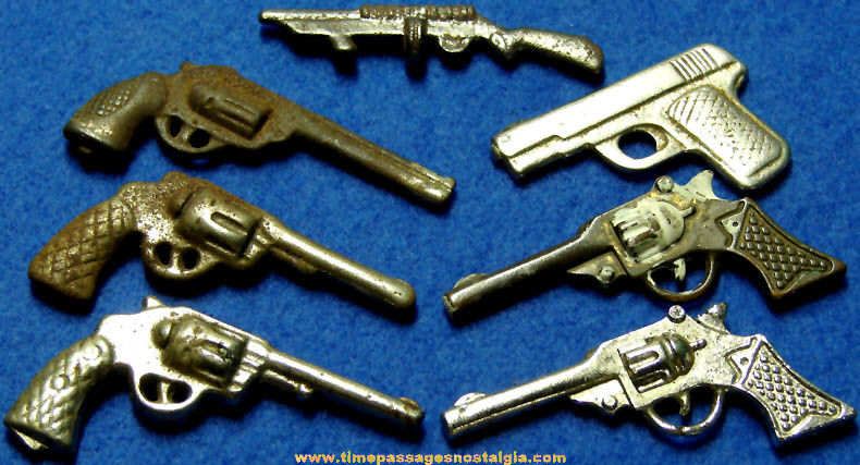 (7) Miniature Cast Iron Arcade Toy Guns