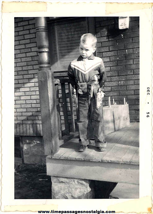 Boy In A Cowboy Outfit With Cap Guns December 1956 Photograph