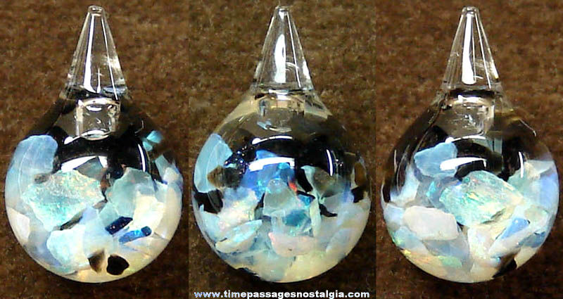 Many Colorful Opal Stone Chips Sealed in a Round Glass Bauble