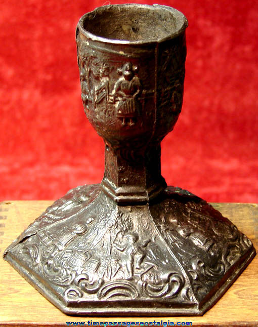 Heavy Old Molded Metal Candle Holder with Family Scenes