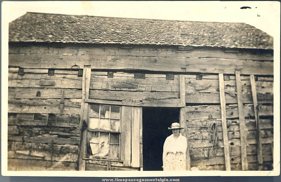 Old Woman and Hand Hewn Log Home or Barn Photograph