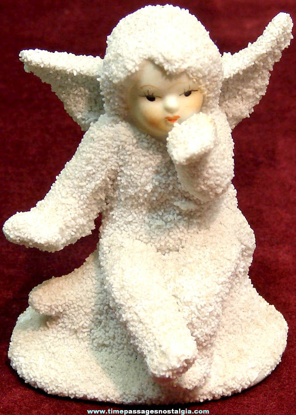Seated Snow Baby Angel Porcelain Figurine