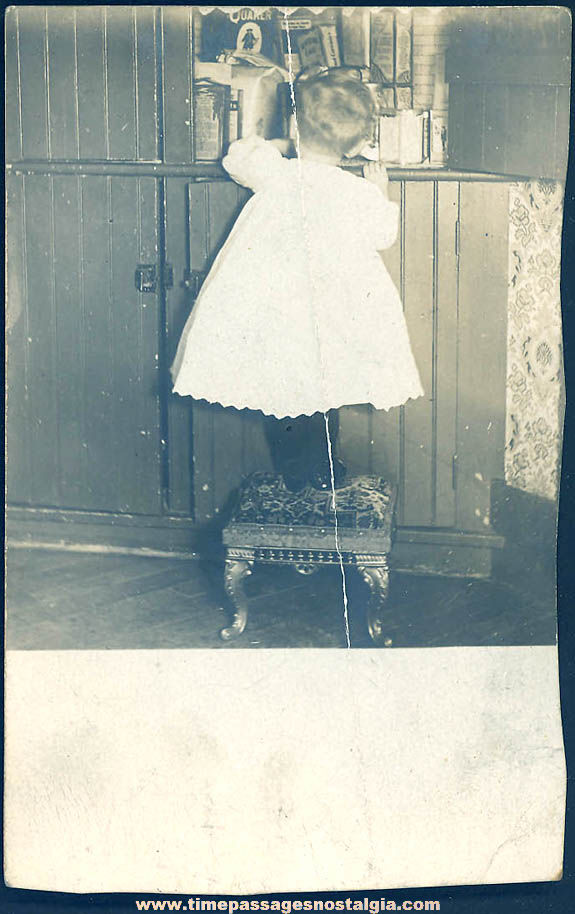 1908 Real Photo Post Card of Child Getting Into A Food Cabinet