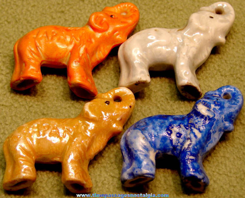 (4) Different Colored 1930s Cracker Jack Pop Corn Confection Porcelain Elephant Animal Figurine Toy Prizes