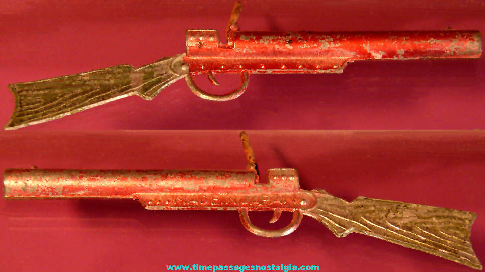 Old Cracker Jack Pop Corn Confection Pot Metal or Lead Miniature Toy Prize Spring Action Match Stick Rifle Gun