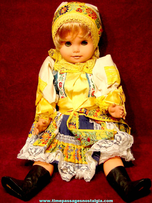 Old Unidentified Colorful Dressed Toy Blonde Girl Doll