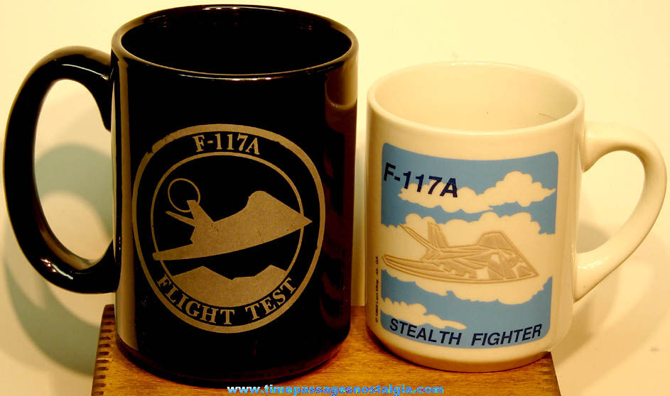 (2) Different United States Air Force F-117A Stealth Fighter Aircraft Advertising Ceramic Coffee Mugs