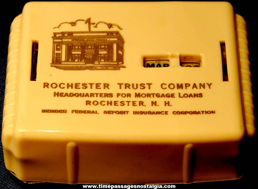Old Metal and Plastic Novelty Rochester Trust Company Advertising Coin Savings Calendar Bank